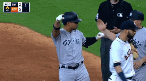 A Baseball Player For The New York Yankees Stands On The Field GIF