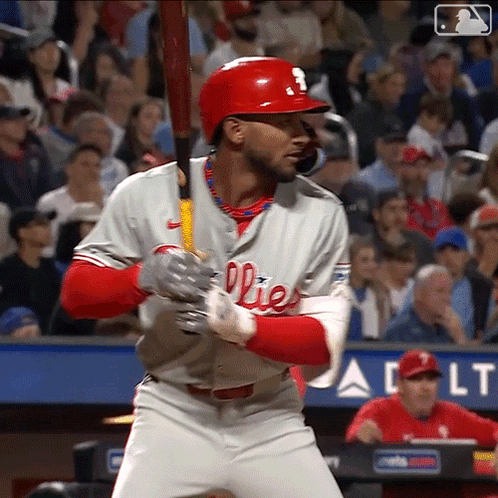 A Baseball Player For The Phillies Is Getting Ready To Swing His Bat GIF