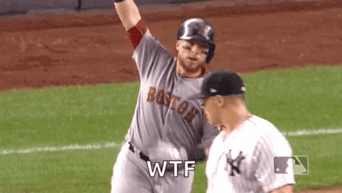 A Baseball Player From The Boston Red Sox Is Standing Next To Another Player On The Field . GIF