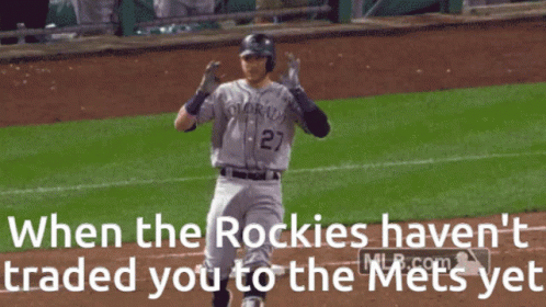 A Baseball Player From The Colorado Rockies Holds His Head In His Hands GIF