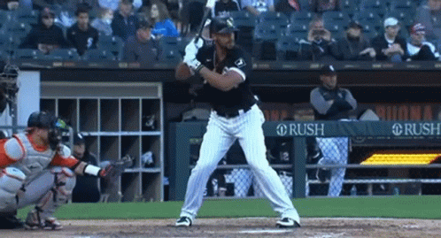 A Baseball Player Getting Ready To Hit The Ball With A Banner In The Background That Says Rush GIF