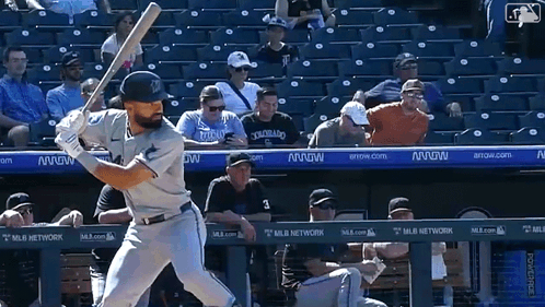 A Baseball Player Getting Ready To Swing His Bat In Front Of A Mlb Network Banner GIF