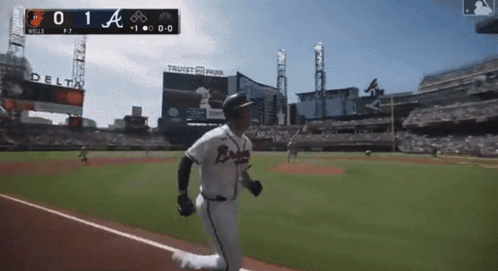 A Baseball Player In A Braves Uniform Is Running On A Baseball Field GIF