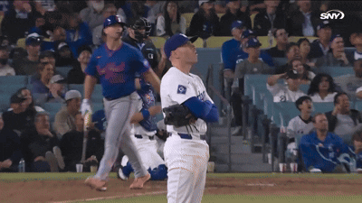 A Baseball Player In A Dodgers Uniform Looks Up At The Sky GIF