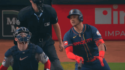 A Baseball Player In Front Of A Reliant Ad GIF
