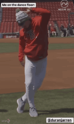 a baseball player is dancing on the dance floor while wearing a red shirt with the letter b on it