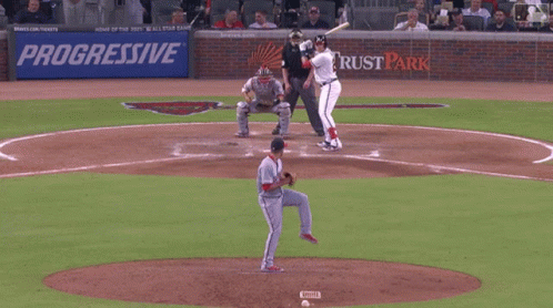 A Baseball Player Is Getting Ready To Swing At A Ball GIF