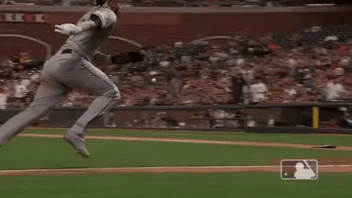 A Baseball Player Is Getting Ready To Throw A Ball While A Catcher Looks On . GIF