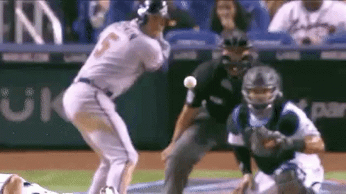 A Baseball Player Is Getting Ready To Throw A Ball While A Catcher Watches . GIF