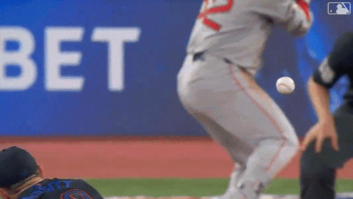 A Baseball Player Is Getting Ready To Throw The Ball While Another Player Watches . GIF