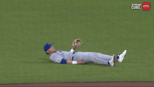 A Baseball Player Is Laying On The Ground With The Words Stream Cubs On The Bottom GIF