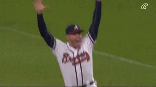 A Baseball Player Is Running On The Field While Wearing A Braves Jersey . GIF