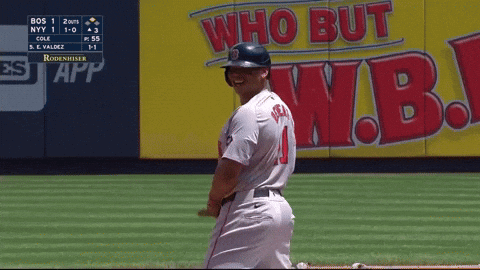 A Baseball Player Is Smiling In Front Of A Wall That Says Who But W.b. GIF