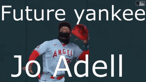 A Baseball Player Is Standing In Front Of A Wall That Says Future Yankees Jo Adell GIF