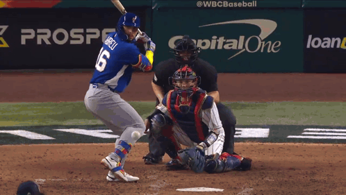 A Baseball Player Is Swinging At A Pitch In Front Of A Capital One Advertisement GIF