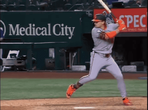 A Baseball Player Is Swinging At A Pitch In Front Of A Medical City Sign GIF