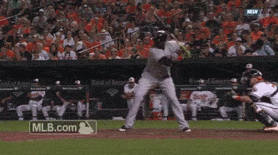 a baseball player is swinging his bat at a pitch while a mlb.com logo is visible in the background