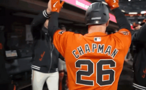 A Baseball Player Named Chapman Is Wearing A Number 26 Jersey GIF