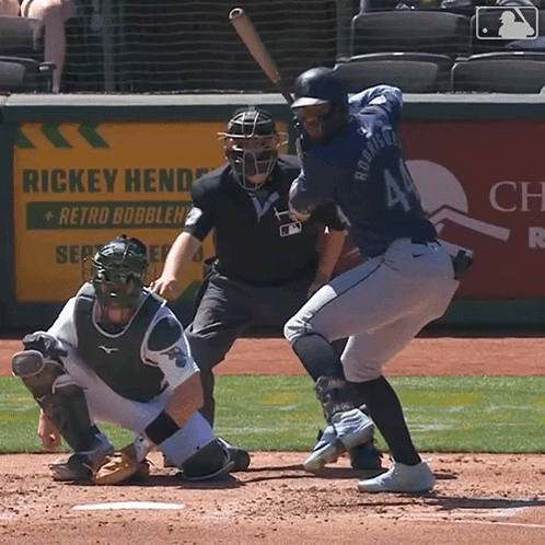 A Baseball Player Named Rickey Henderson Swings At A Pitch GIF