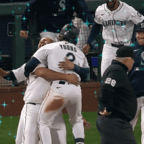 A Baseball Player Named Young Is Hugging Another Player GIF