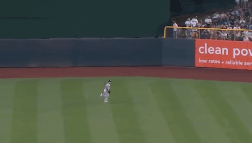 A Baseball Player Runs Towards A Clean Power Sign GIF