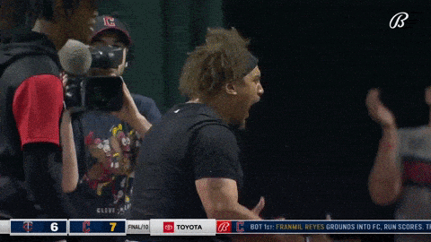A Baseball Player Screams In Front Of A Toyota Logo GIF