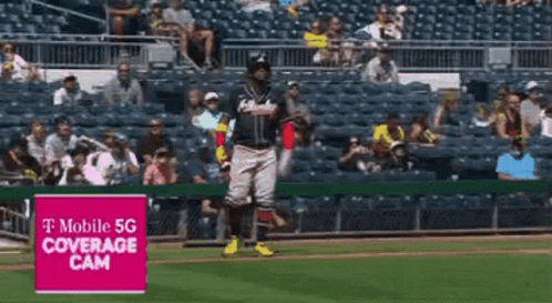 A Baseball Player Stands On The Field In Front Of A T Mobile 5G Coverage Cam GIF
