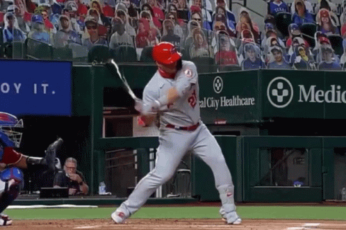 A Baseball Player Swings At A Pitch In Front Of A Sign That Says Medical City Healthcare GIF