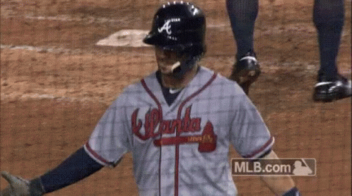 A Baseball Player Wearing A Atlanta Braves Jersey GIF