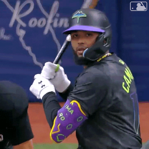 A Baseball Player Wearing A Black Jersey With The Number 1 On It GIF