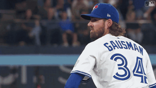 A Baseball Player Wearing A Blue Jays Uniform With The Number 34 On The Back GIF
