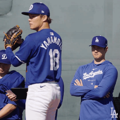 A Baseball Player Wearing A Blue Jersey With The Number 18 On It GIF