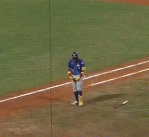 A Baseball Player Wearing A Blue Jersey With The Number 21 On It GIF