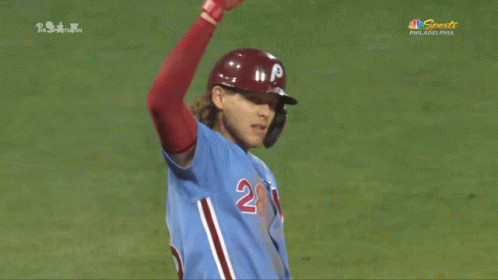 A Baseball Player Wearing A Blue Jersey With The Number 28 On The Front GIF