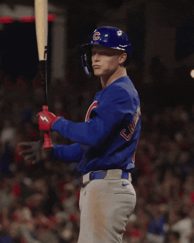 A Baseball Player Wearing A Blue Shirt That Says Cubs On It GIF