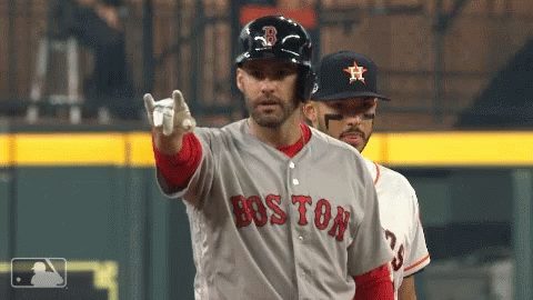 A Baseball Player Wearing A Boston Jersey Points At The Camera GIF