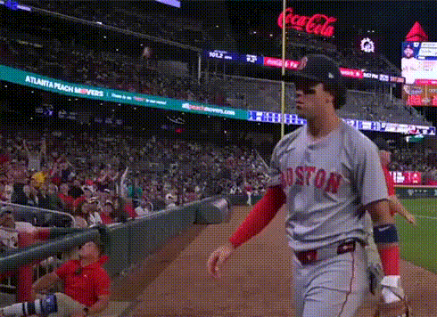A Baseball Player Wearing A Boston Jersey Walks Towards The Dugout GIF