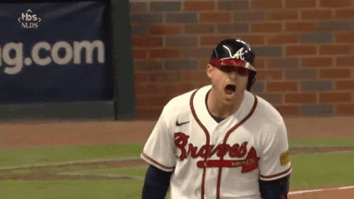 A Baseball Player Wearing A Braves Jersey Is Screaming GIF