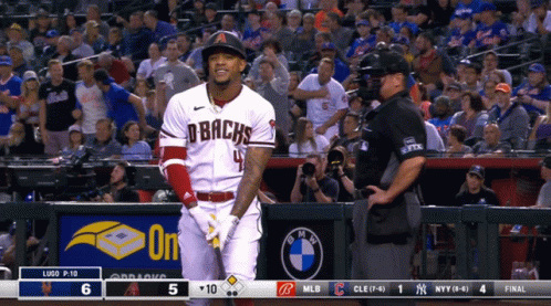 A Baseball Player Wearing A Dbacks Jersey Stands In Front Of A Crowd GIF