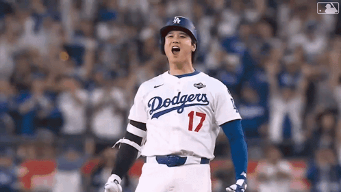 A Baseball Player Wearing A Dodgers Jersey Is Standing On The Field . GIF