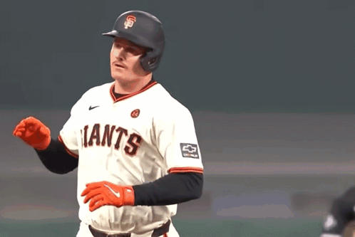 A Baseball Player Wearing A Giants Jersey Waves His Hand GIF