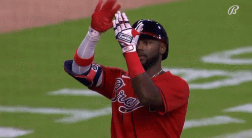 A Baseball Player Wearing A Glove That Says Rawlings GIF