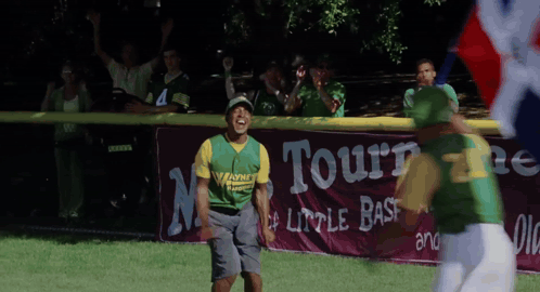 A Baseball Player Wearing A Green And Yellow Jersey With The Word Warner On It GIF
