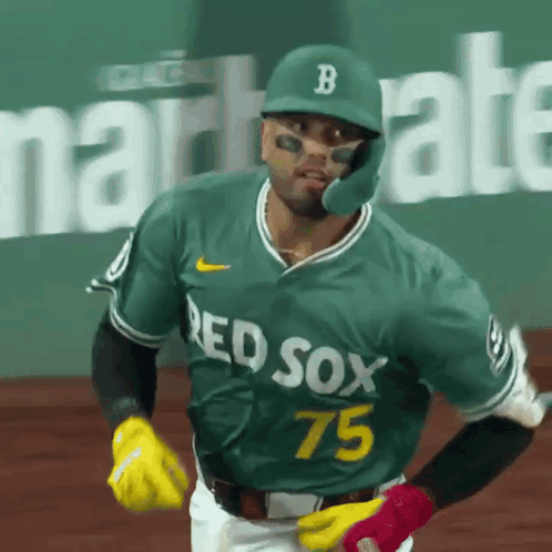 A Baseball Player Wearing A Green Jersey That Says Red Sox 75 On It GIF