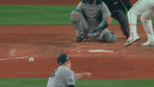 A Baseball Player Wearing A Green Jersey That Says Reds On It GIF