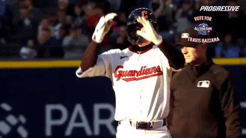 A Baseball Player Wearing A Guardians Uniform Stands On The Field GIF