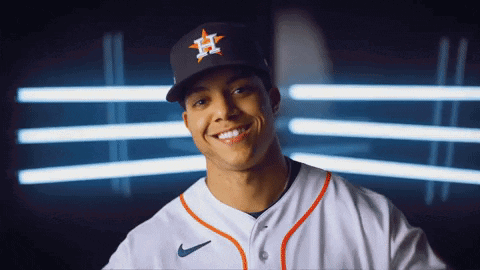 A Baseball Player Wearing A Hat With The Letter H On It Smiles GIF