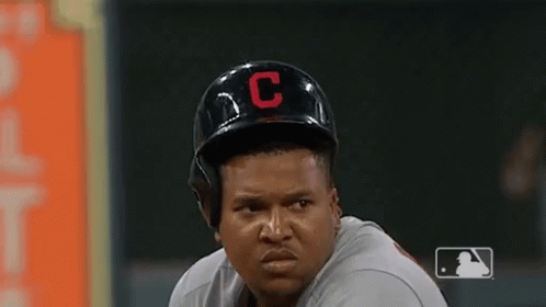 A Baseball Player Wearing A Helmet With A C On It GIF