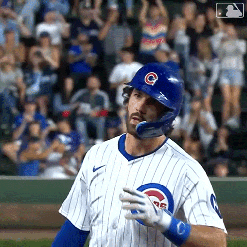 A Baseball Player Wearing A Helmet With The Letter C On It Is Standing On The Field . GIF