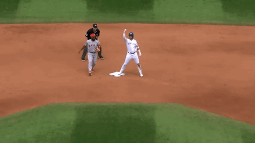 A Baseball Player Wearing A Jersey That Says Angels On It GIF